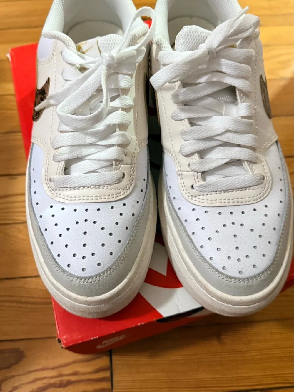 Nike Women’s White Sneakers with Leopard-Print Swoosh